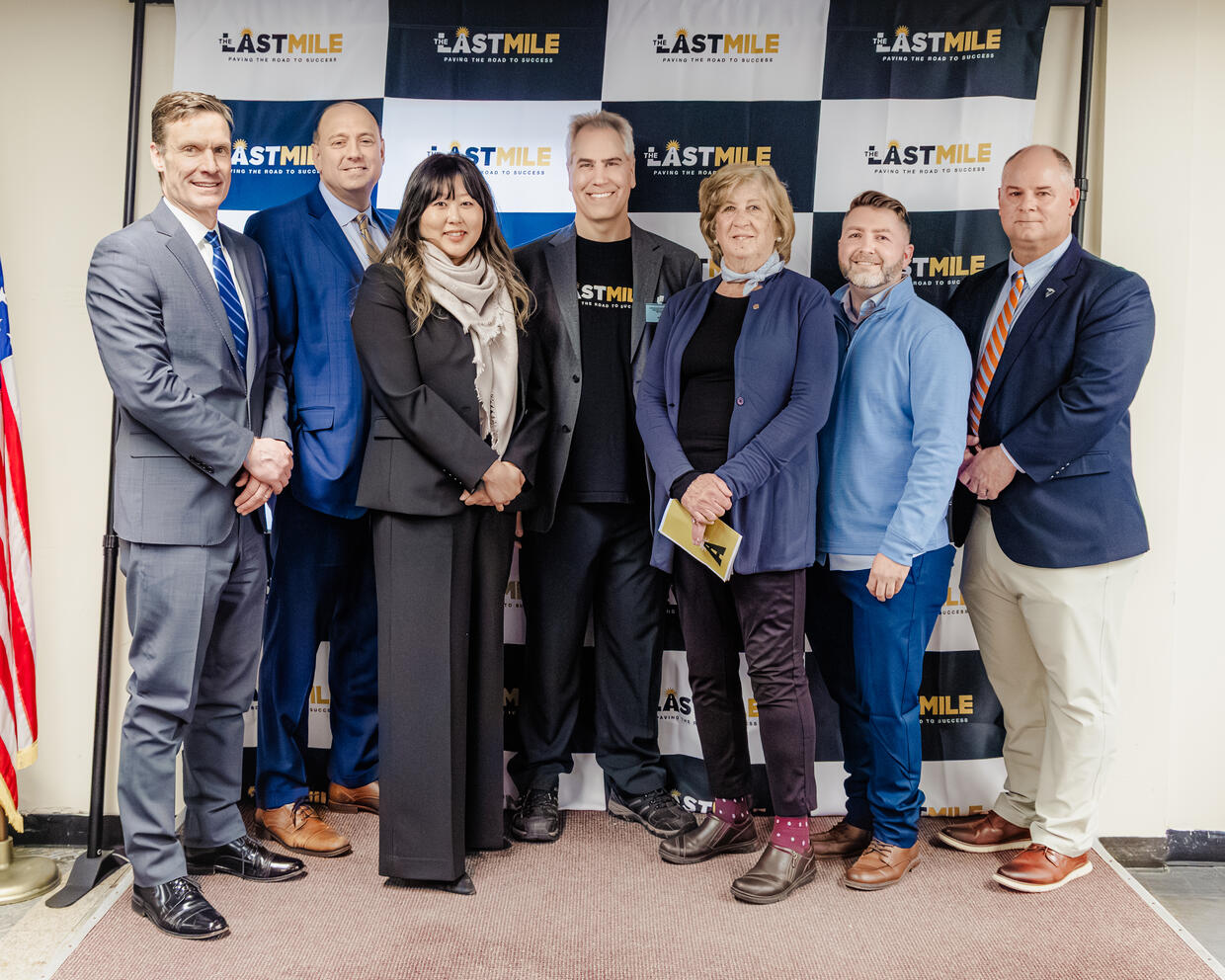 Officials attending The Last Mile graduation included (from left to right) DOC Commissioner Shawn Jenkins, State Sen. Jamie Eldridge, Public Safety and Security Secretary Gina Kwon, The Last Mile's Pete Blumenthal, State Rep. Mary Keefe, Classroom Facilitator Christopher Lounsbury, and Undersecretary of Criminal Justice Andrew Peck.